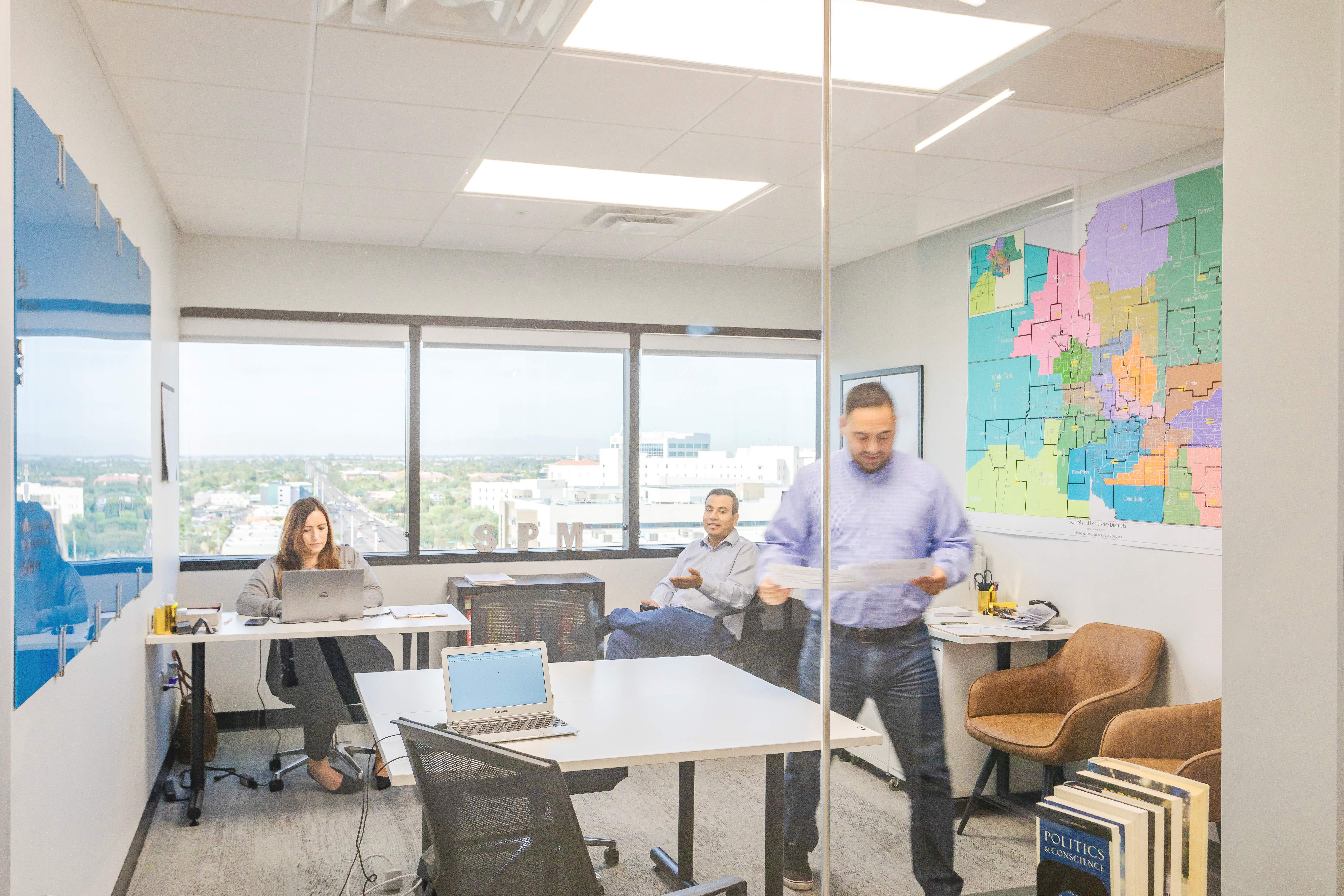 Hybrid team working together in a shared workspace