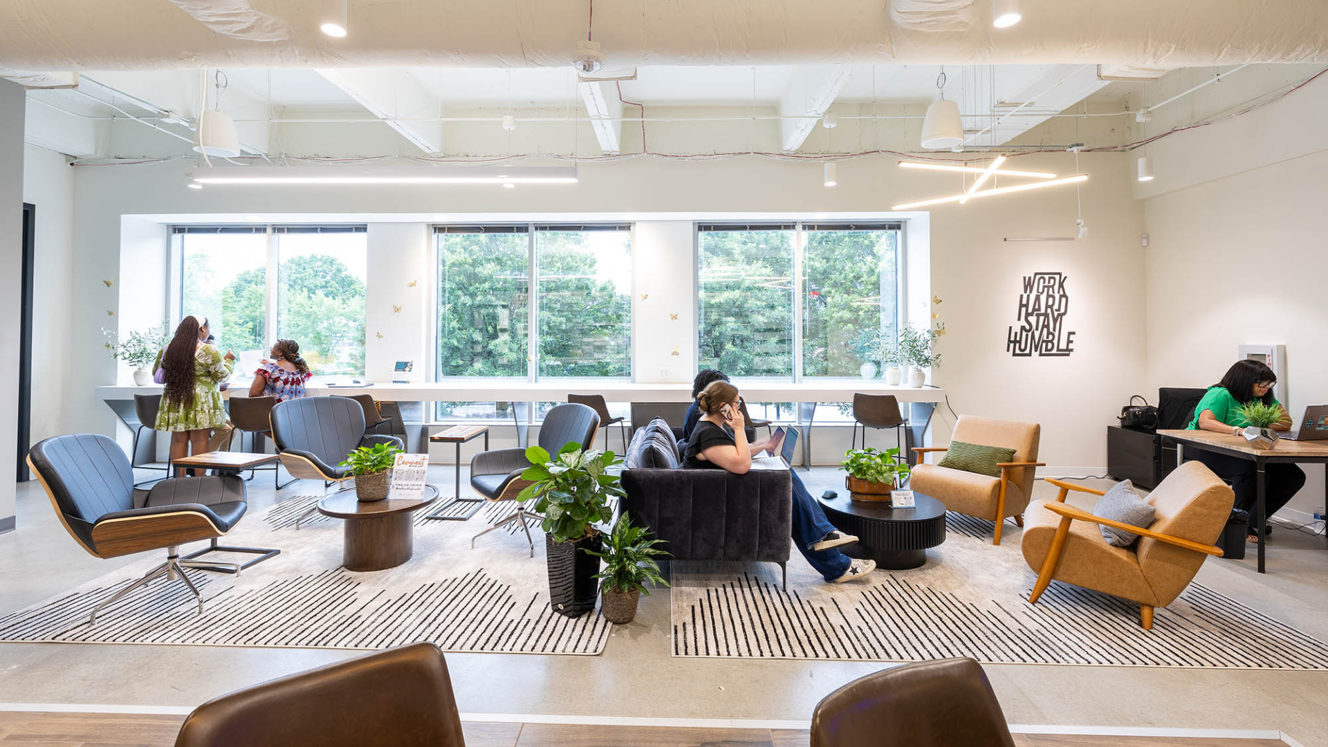 Expansive members working and connecting in a shared workspace